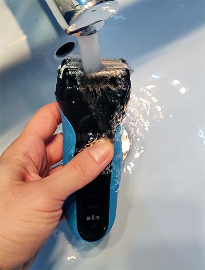 Cleaning a Series 3 shaver with tap water.
