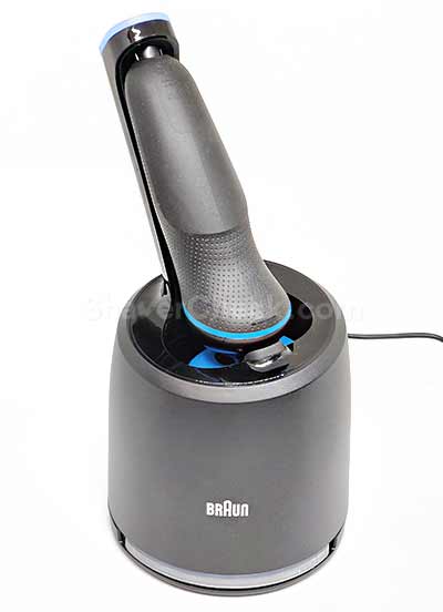 Cleaning the Braun 5018s in a compatible cleaning station.