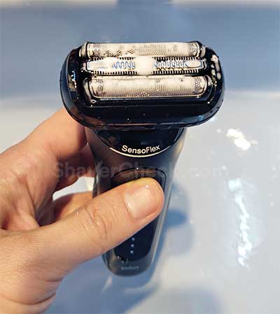 Cleaning the shaver with water and liquid soap.