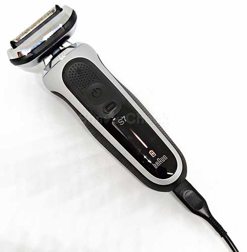 Charging the shaver with the included cord.