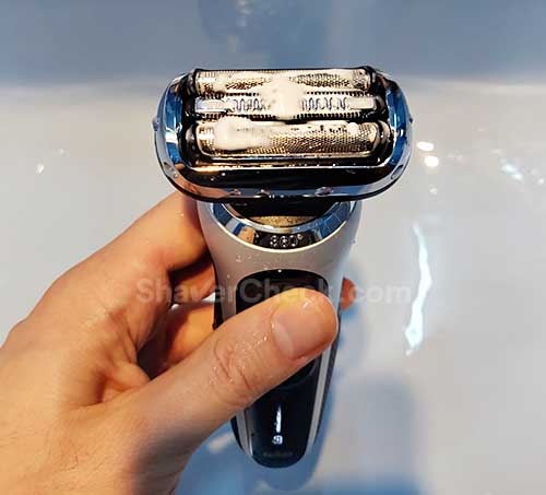 Cleaning the shaver with liquid soap.