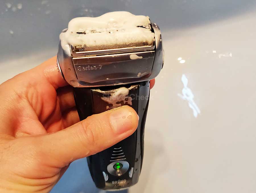 Turning on the shaver to lather the soap