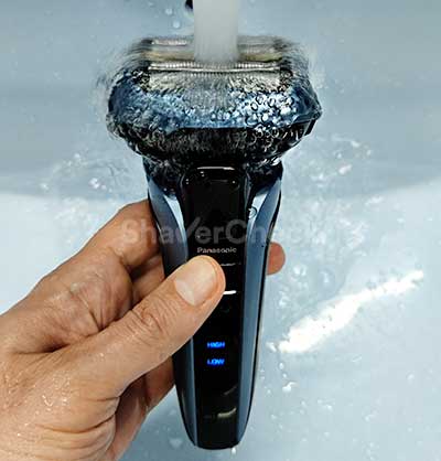 Rinsing the head with water while the sonic mode is active.
