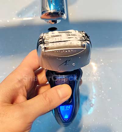 Cleaning the shaver with soap and water.