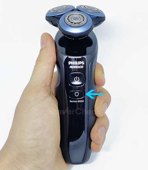The button that activates the Skin Guard mode on the Philips Shaver 6800.