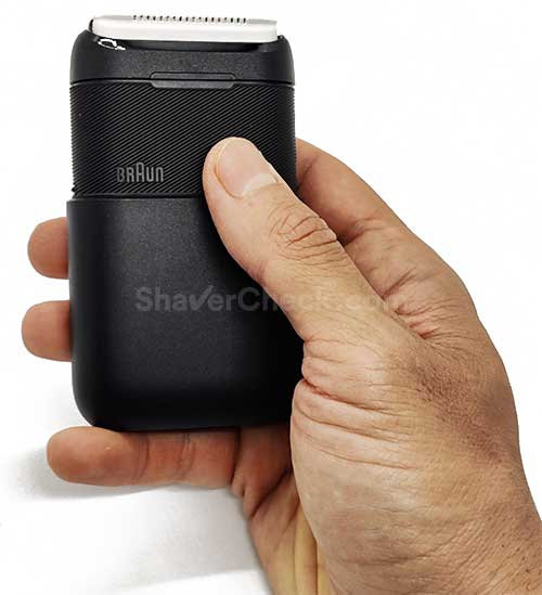 The compact Xiaomi Braun Mijia shaver held in hand.