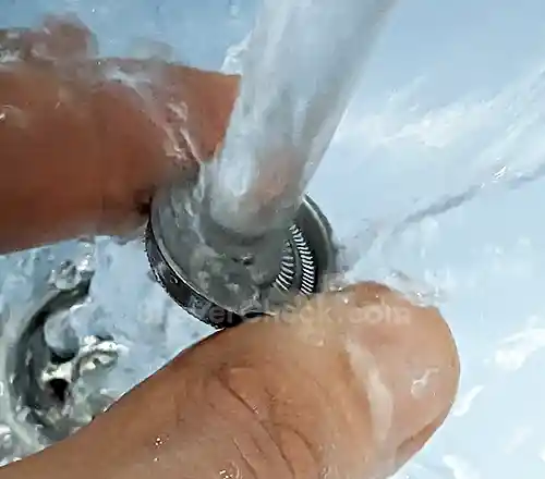 Cleaning a guard with water.