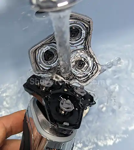 Rinsing the Philips Series 9000 with water.