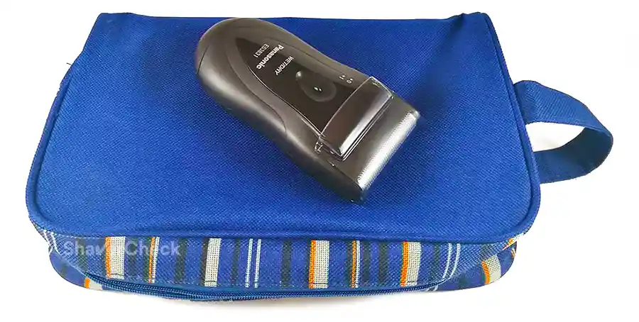 Travel shaver with protective cap.